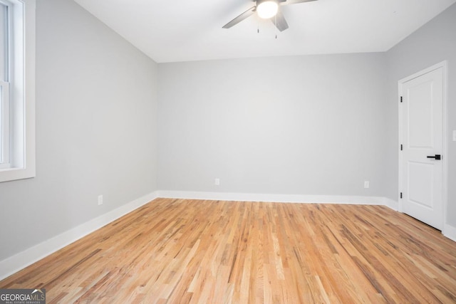 spare room featuring ceiling fan and light hardwood / wood-style floors