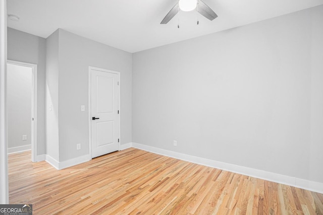 unfurnished room featuring ceiling fan and light wood-type flooring