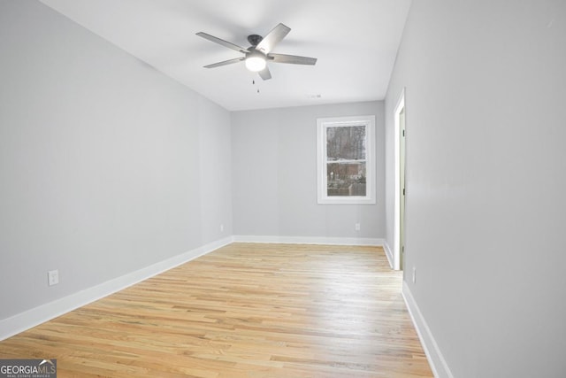 empty room featuring ceiling fan and light wood-type flooring