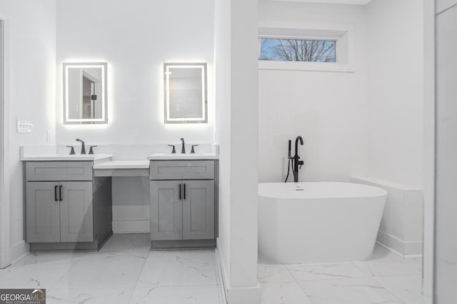 bathroom with vanity and a bathtub