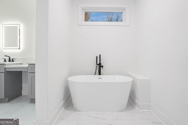 bathroom featuring vanity and a bathtub