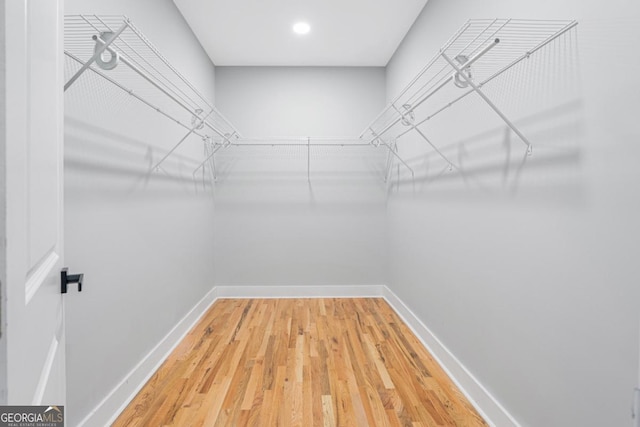 walk in closet featuring hardwood / wood-style floors