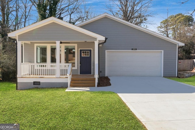 view of front of home featuring a porch, a garage, and a front yard