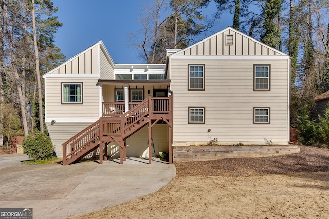 rear view of house featuring a patio area and covered porch