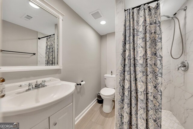 full bathroom with vanity, toilet, and shower / tub combo