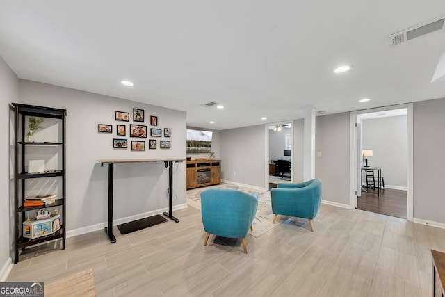 sitting room featuring light hardwood / wood-style flooring