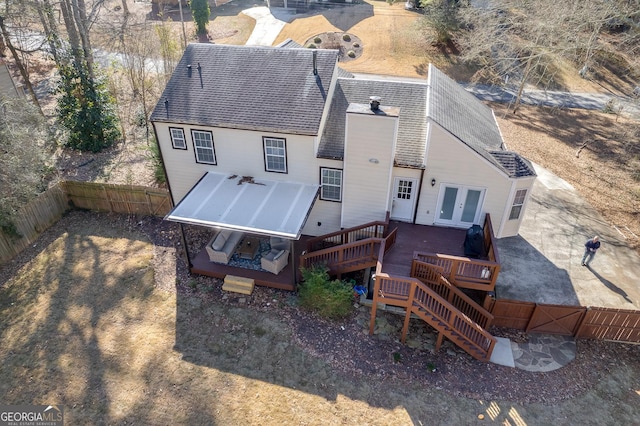 back of house with french doors and a deck