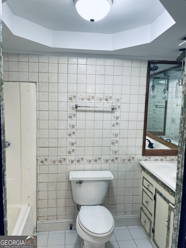 bathroom featuring vanity, tile patterned floors, and toilet