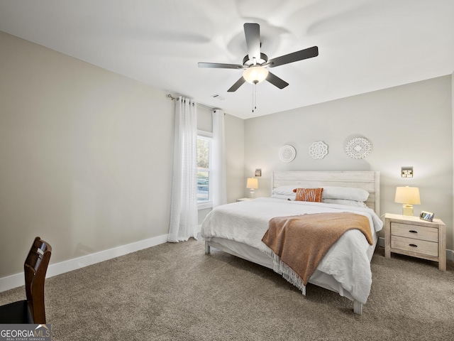 bedroom featuring ceiling fan and carpet