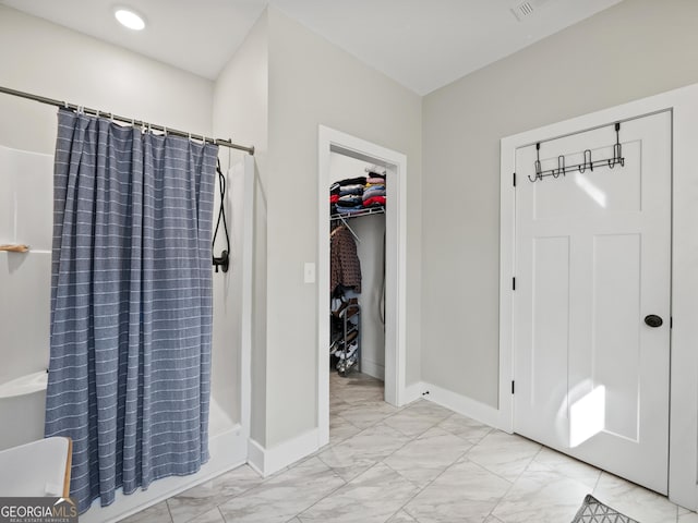 bathroom with a shower with shower curtain