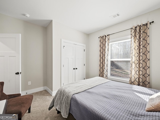 bedroom with carpet floors and a closet