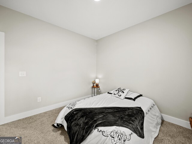 bedroom featuring carpet