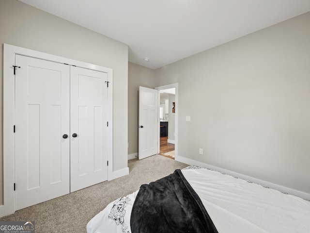 carpeted bedroom featuring a closet