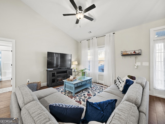 living room featuring vaulted ceiling, hardwood / wood-style floors, and ceiling fan