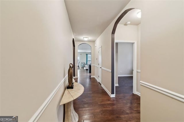 hall with dark hardwood / wood-style floors