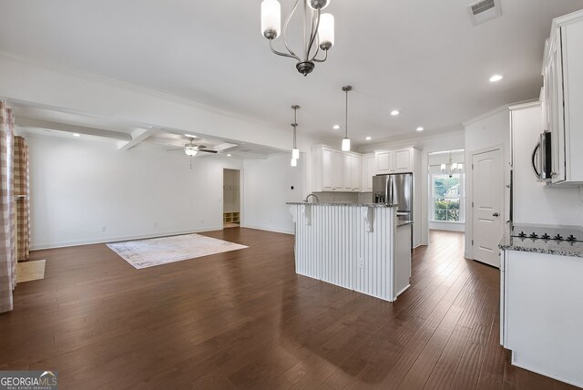 kitchen with a breakfast bar, ceiling fan with notable chandelier, white cabinets, hanging light fixtures, and stainless steel appliances