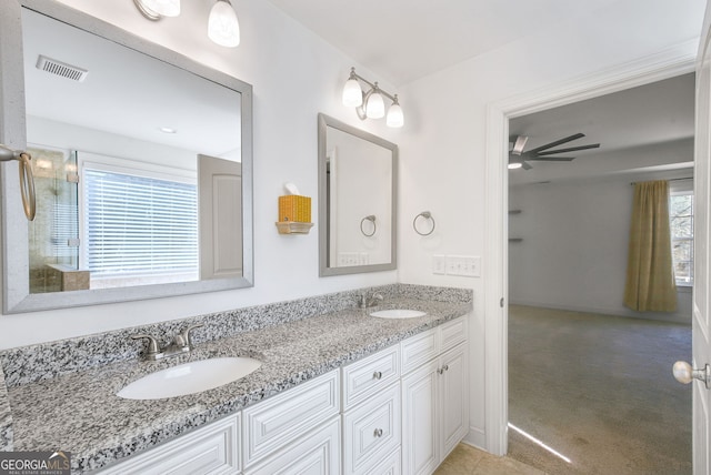 bathroom with vanity and ceiling fan