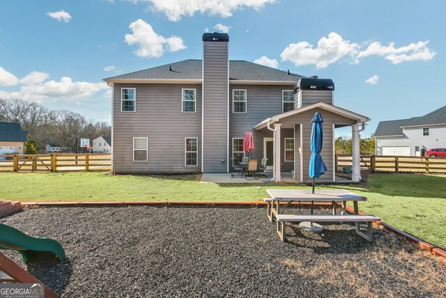 view of yard with a playground and a storage unit