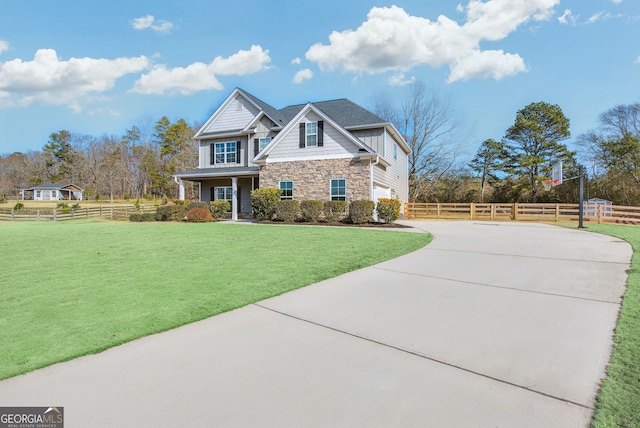 craftsman-style home with a front lawn