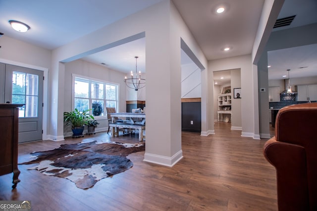 1291 Pleasant Grove Church Rd, Villa Rica, GA 30180 - foyer entrance with a chandelier and dark hardwood / wood-style flooring