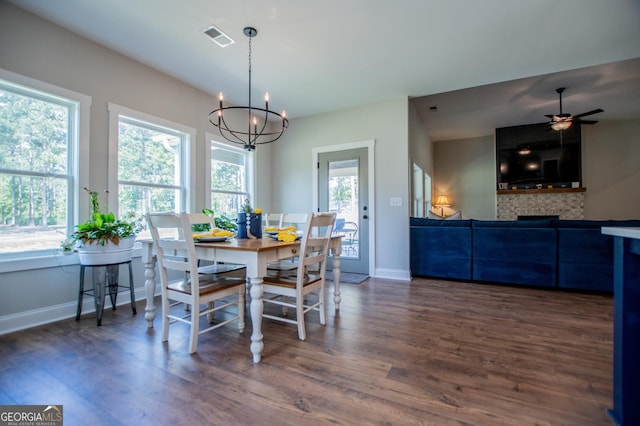 1291 Pleasant Grove Church Rd, Villa Rica, GA 30180 - dining room featuring dark wood-type flooring, plenty of natural light, and ceiling fan with notable chandelier