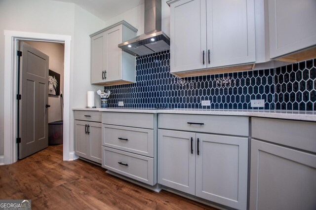 1291 Pleasant Grove Church Rd, Villa Rica, GA 30180 - kitchen with gray cabinets, backsplash, dark hardwood / wood-style flooring, and wall chimney exhaust hood