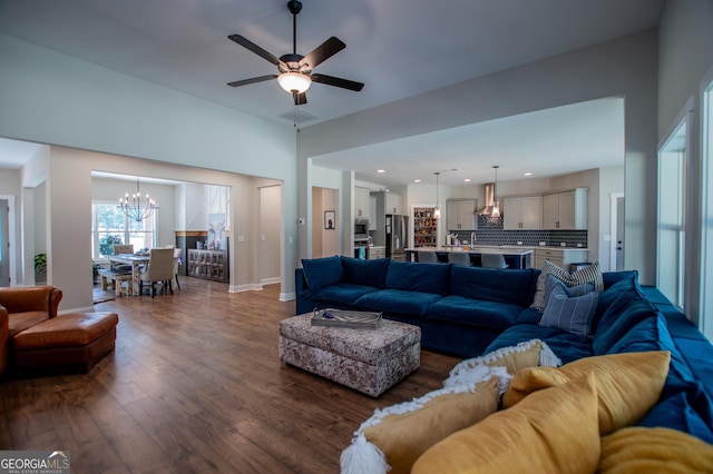 1291 Pleasant Grove Church Rd, Villa Rica, GA 30180 - living room featuring dark wood-type flooring and ceiling fan with notable chandelier