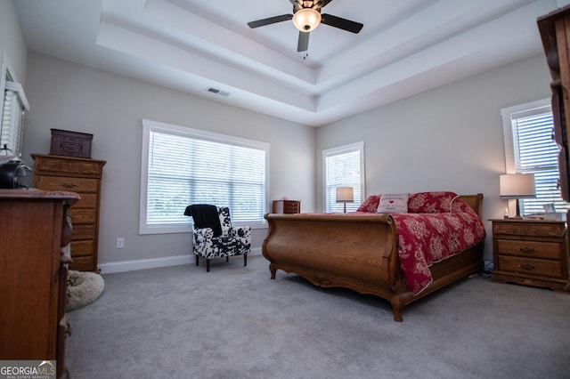 1291 Pleasant Grove Church Rd, Villa Rica, GA 30180 - carpeted bedroom featuring a raised ceiling and ceiling fan