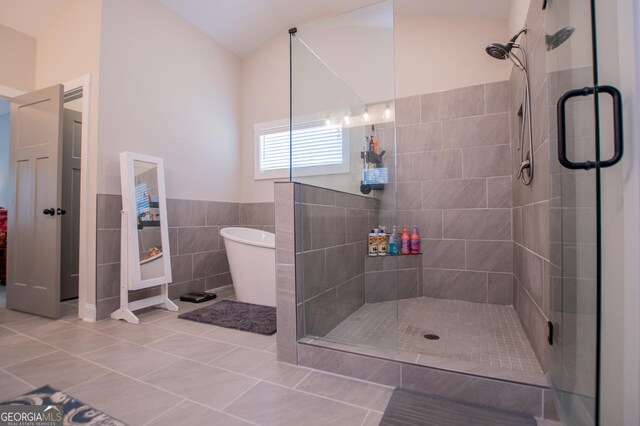 1291 Pleasant Grove Church Rd, Villa Rica, GA 30180 - bathroom featuring tile patterned flooring, tile walls, and walk in shower