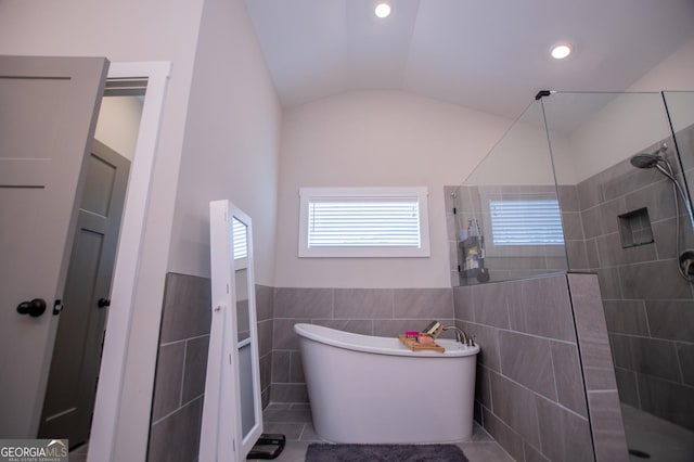 1291 Pleasant Grove Church Rd, Villa Rica, GA 30180 - bathroom featuring lofted ceiling, tile walls, and separate shower and tub