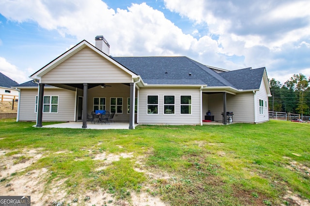 1291 Pleasant Grove Church Rd, Villa Rica, GA 30180 - back of house featuring ceiling fan, a patio, and a lawn