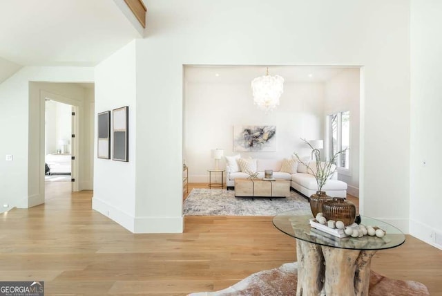 interior space featuring a chandelier and light wood-type flooring