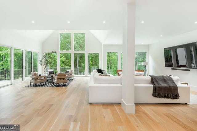 sunroom featuring a wealth of natural light and vaulted ceiling