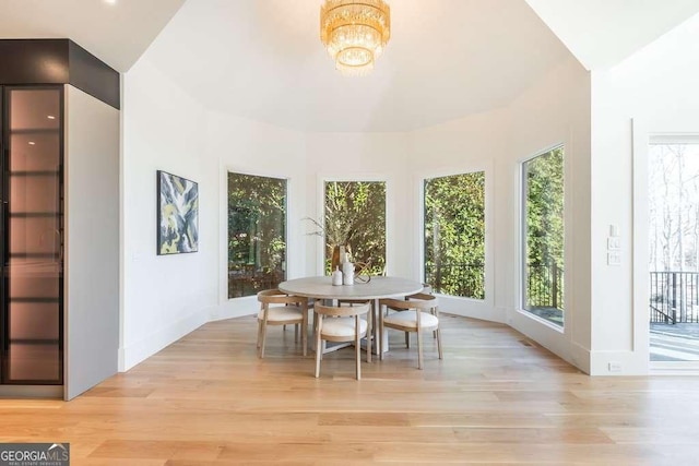 sunroom / solarium with a notable chandelier and plenty of natural light