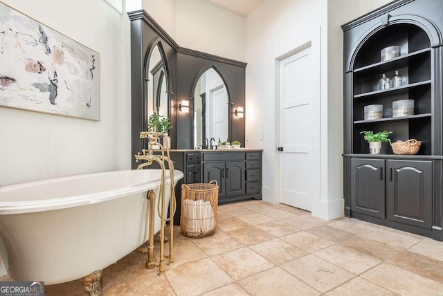 bathroom with a tub to relax in and vanity