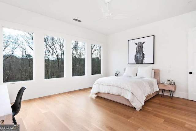 bedroom featuring hardwood / wood-style floors and ceiling fan