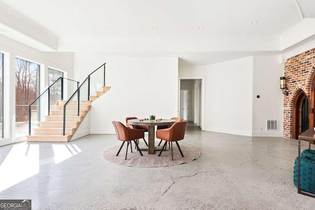 dining room with concrete flooring