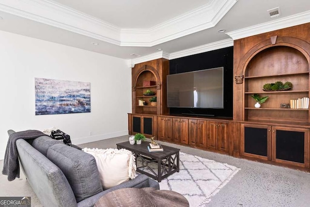 living room with a raised ceiling, crown molding, and built in features