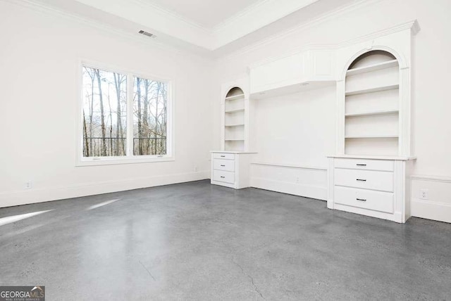 interior space featuring crown molding and a raised ceiling