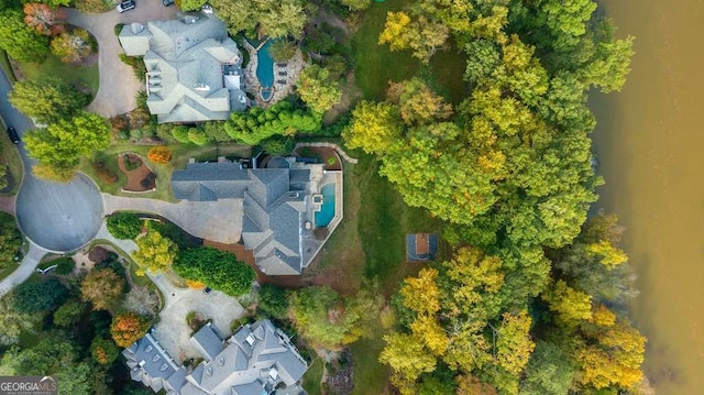 birds eye view of property featuring a water view