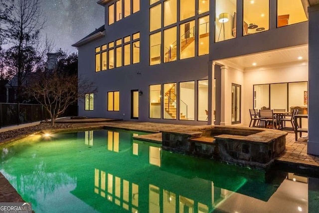 view of swimming pool with an in ground hot tub and a patio