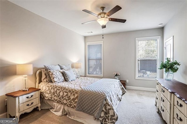 carpeted bedroom featuring ceiling fan