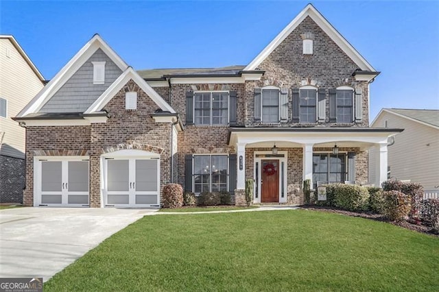 view of front of house featuring a garage and a front yard