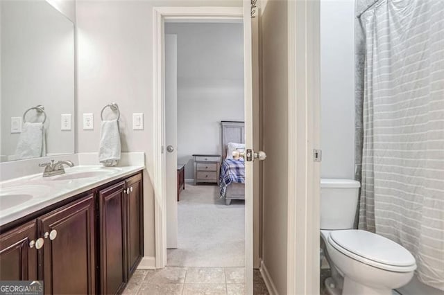 bathroom with vanity and toilet