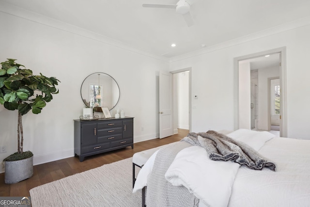 bedroom featuring crown molding, ceiling fan, and dark hardwood / wood-style flooring