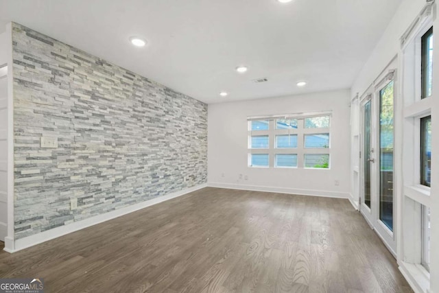 spare room featuring dark hardwood / wood-style floors