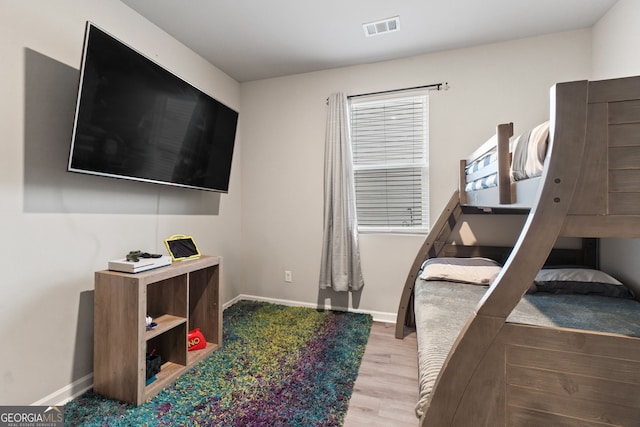 bedroom with wood-type flooring