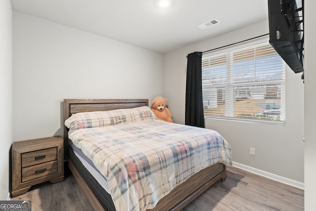 bedroom with light hardwood / wood-style floors