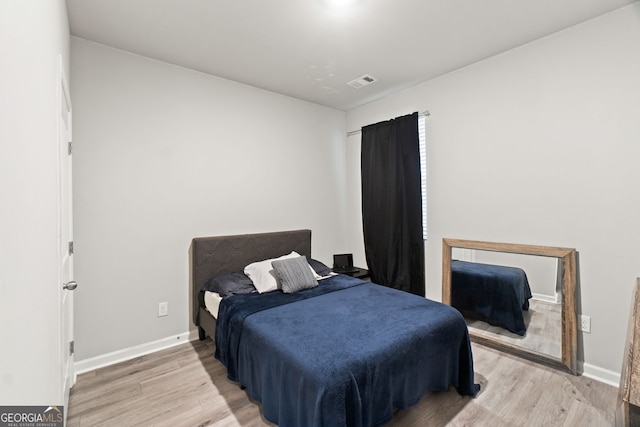 bedroom with light hardwood / wood-style flooring