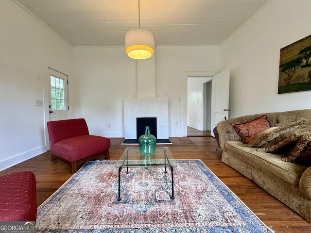 392 Taylor Ave, Macon, GA 31217 - living area featuring ornamental molding, a large fireplace, wood finished floors, and baseboards